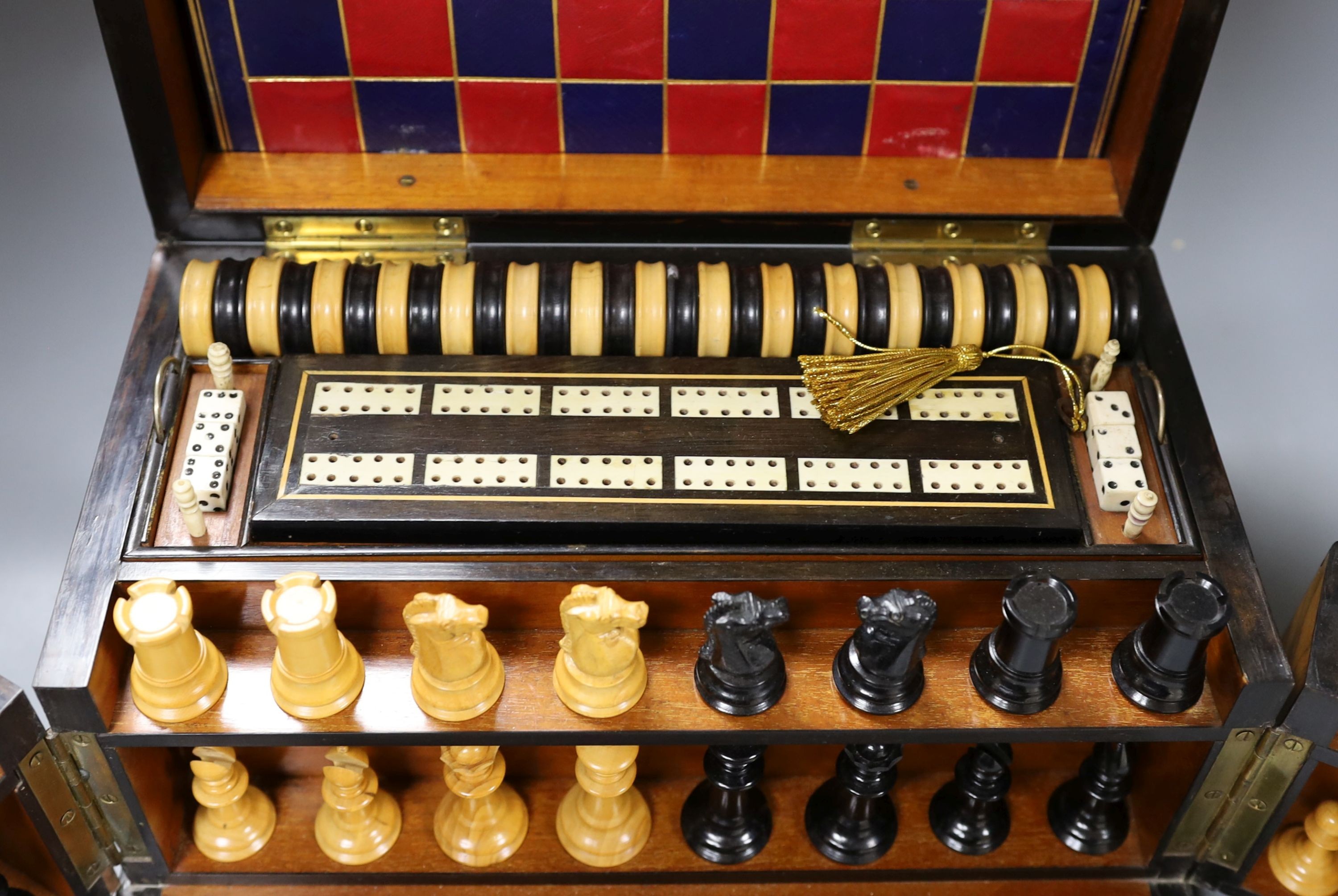 A Victorian walnut games compendium, 33cm wide